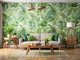 Modern living room with eco-friendly leaf-patterned wallpaper and indoor plants creating a sustainable atmosphere